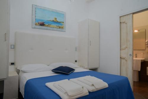 Postel nebo postele na pokoji v ubytování Baia Di Torre Squillace