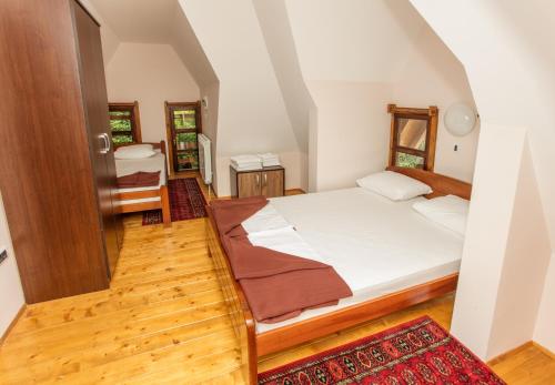 a bedroom with a bed in a room at Konačište Osmica in Mokra Gora