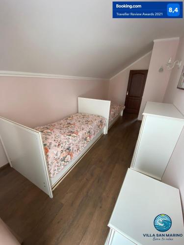 Postel nebo postele na pokoji v ubytování Villa San Marino