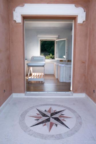 a bathroom with a tub and a star on the floor at Villa Lattanzi in Marina Palmense