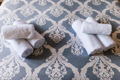 a group of towels sitting on top of a table at Irish House Međugorje in Međugorje