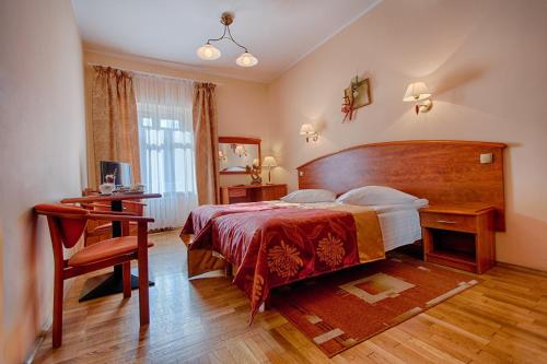En eller flere senge i et værelse på Hotel Restauracja Caspar