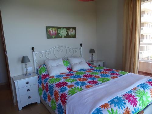 Кровать или кровати в номере Apartamentos Punta Cormorán