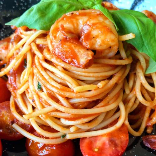 a pile of pasta with shrimp on top of it at Hotel Berg in Staré Splavy