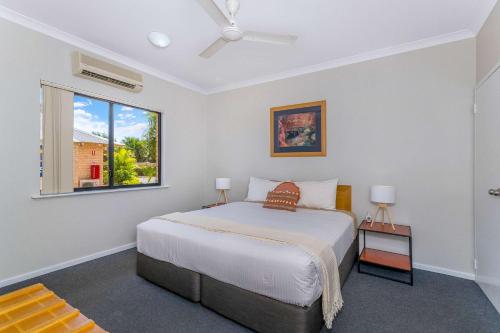 a bedroom with a bed and a window at Comfort Inn & Suites Karratha in Karratha