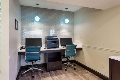 an office with two computers on a desk with two chairs at Quality Inn Gulfport I-10 in Gulfport