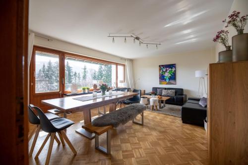 a living room with a table and a couch at Landhaus Mettenberg in Eslohe