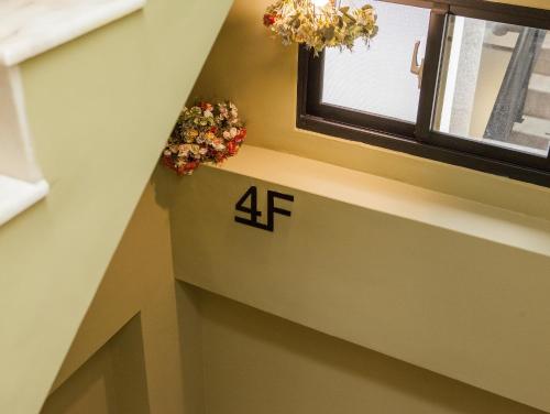 a stairwell with a number on the wall next to a window at Taitung Sun forest in Taitung City