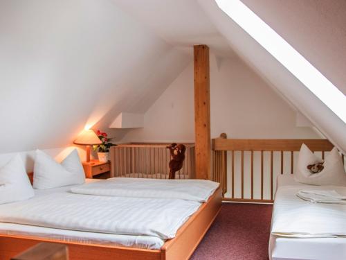Voodi või voodid majutusasutuse Landhotel & Reiterhof Schumann toas