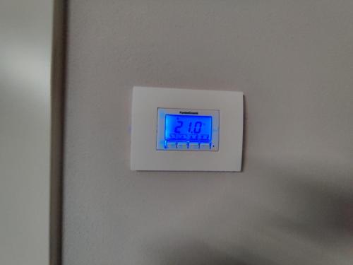 a clock on a wall with a clock on it at BERTESINA325 Superior Apartment in Vicenza