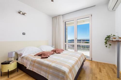 Postel nebo postele na pokoji v ubytování Villa Rožica
