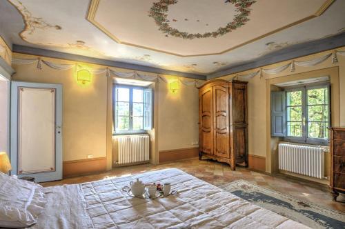 Ένα ή περισσότερα κρεβάτια σε δωμάτιο στο Palazzo Rosadi
