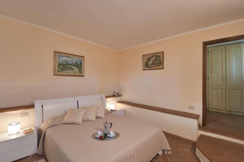 a bedroom with a bed with a plate on it at Nicchio in Gaiole in Chianti