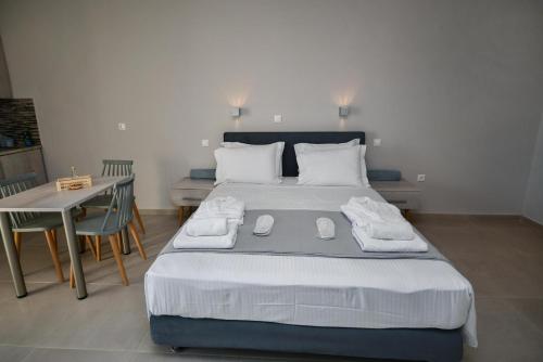 מיטה או מיטות בחדר ב-Asterisuites