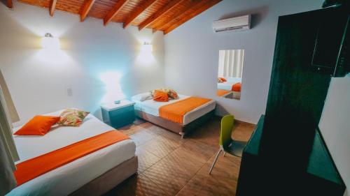 Ένα ή περισσότερα κρεβάτια σε δωμάτιο στο Hotel la Ardilla de Santa Fe