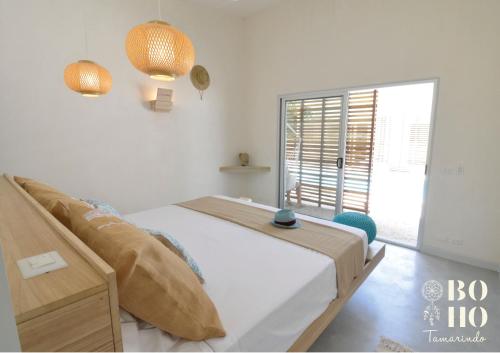 Кровать или кровати в номере BOHO Tamarindo