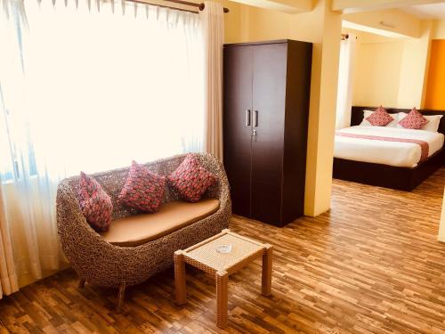 Postel nebo postele na pokoji v ubytování Yeti Inn Pvt. Ltd.
