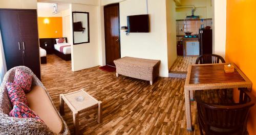 a living room with a couch and a table at Yeti Inn Pvt. Ltd. in Kathmandu