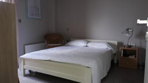 Ένα ή περισσότερα κρεβάτια σε δωμάτιο στο Tzanetos Seaside