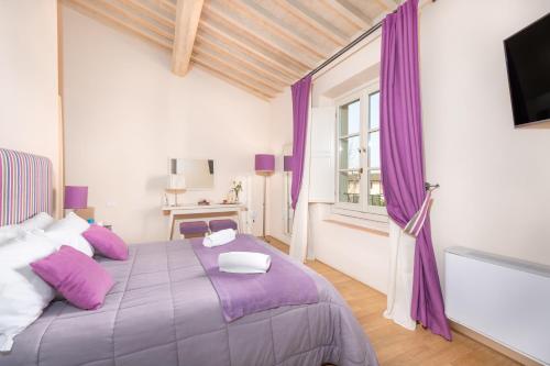 Postel nebo postele na pokoji v ubytování B&B Borgo di Pratavecchie