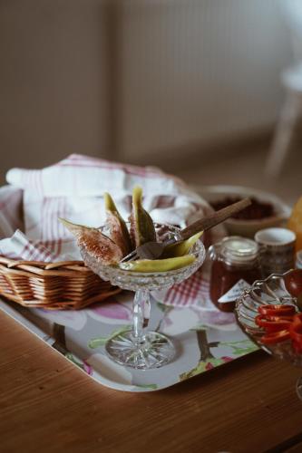 a table with a bowl of food on a table at Axatorpsgården in Trelleborg