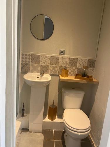 a bathroom with a toilet and a sink at Studio in Brignoles