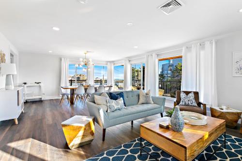 a living room with a couch and a table at Casa del Mar in Point Pleasant Beach