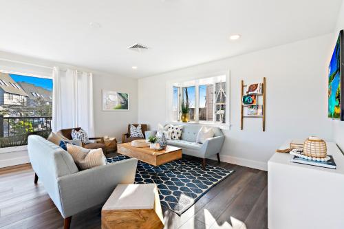 a living room with a couch and a table at Casa del Mar in Point Pleasant Beach