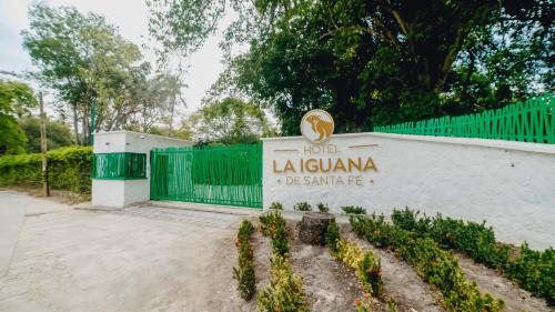 a sign for the hotel la iguana de santa ana at La Iguana de Santa Fe by Bernalo Hotels in Santa Fe de Antioquia