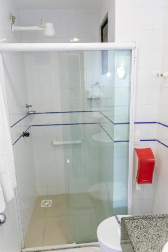 a glass shower in a bathroom with a toilet at Palácio Do Rio Hotel in Teresina