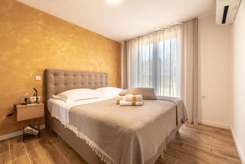 מיטה או מיטות בחדר ב-Villa Rogač