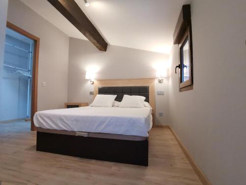 En eller flere senge i et værelse på La Casina del Trasgu