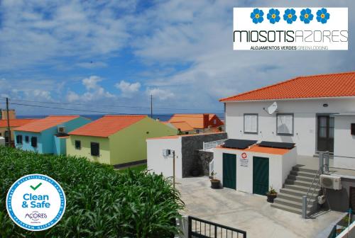 a view of a town with colorful houses at Alojamentos Flores Island in Faja Grande
