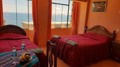 En eller flere senge i et værelse på Hostal resto bar flor de mi tierra