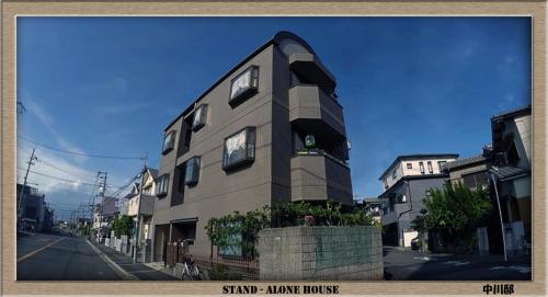 a building on the side of a street at Nakagawa's Cozy House in Sakai