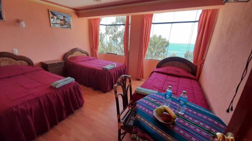 En eller flere senge i et værelse på Hostal resto bar flor de mi tierra