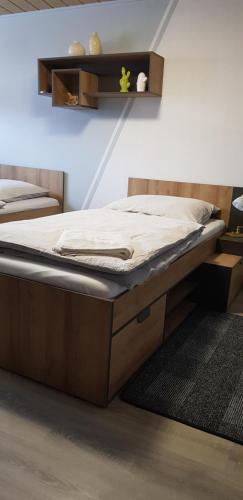 Postel nebo postele na pokoji v ubytování Pension K61 Sylke und Michael Paffrath