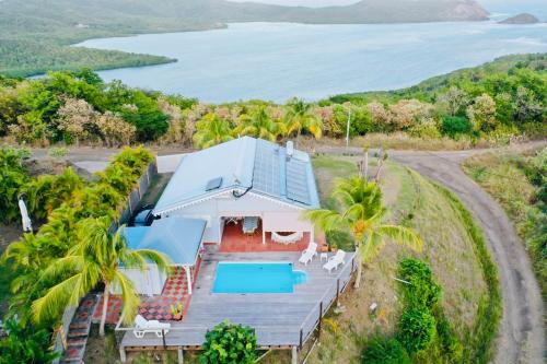 an aerial view of a house with a swimming pool at Villa Vue Sauvage in La Trinité