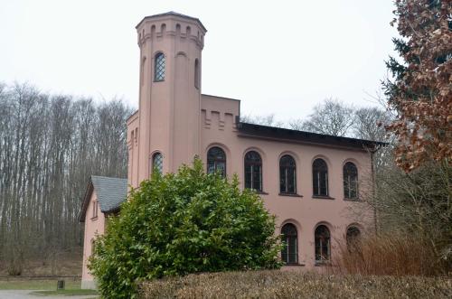 a building with a clock tower on top of it at Meerforelle 207 - Villa Seeblick in Sassnitz