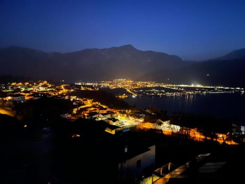 a view of a city at night at Casa Belvedere in Tenna 