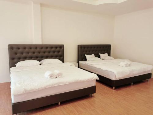 Ένα ή περισσότερα κρεβάτια σε δωμάτιο στο Home Garden Chaeson บ้านสวน ชวนฝัน