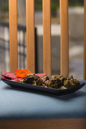 a plate of food sitting on a table at Residency Lake Resort & Spa in Mulshi