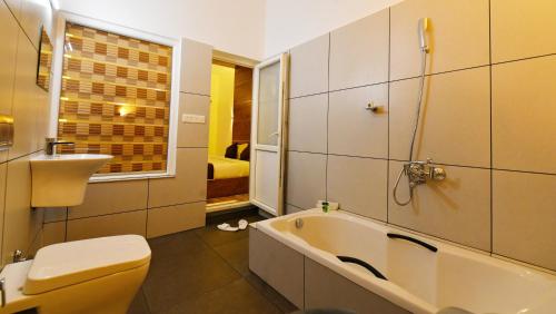 Vonios kambarys apgyvendinimo įstaigoje Palette Hill View Resorts Vagamon