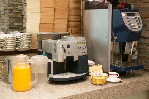 a blender sitting on top of a counter next to a counter top at Kanazawa Central Hotel in Kanazawa