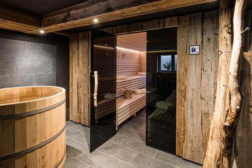 a room with a sauna with wooden walls at Loretto in Oberstdorf