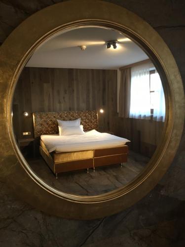 Ένα ή περισσότερα κρεβάτια σε δωμάτιο στο Hotel Fohlenhof