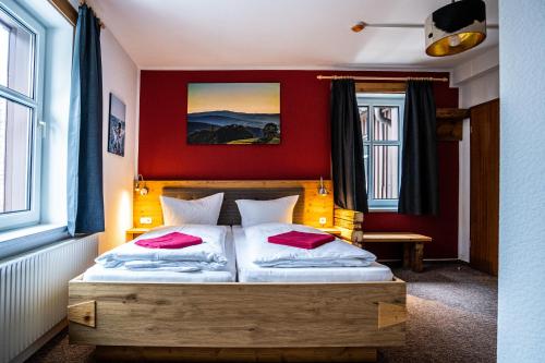 En eller flere senge i et værelse på Berghotel Bärenstein