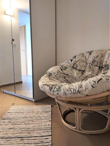 a living room with a couch and a mirror at Guesthouse Vatnsholt in Vatnsholt