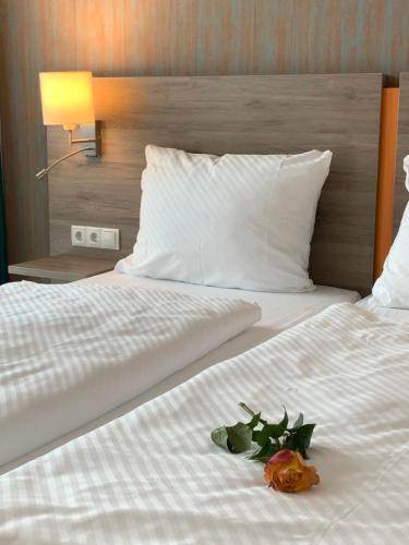 Кровать или кровати в номере RheinVilla ARTE