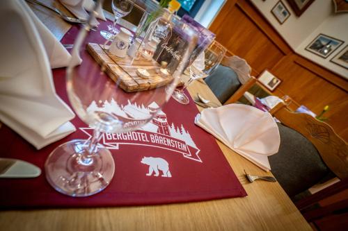 a table with a red placemat on top of it at Berghotel Bärenstein in Bärenstein